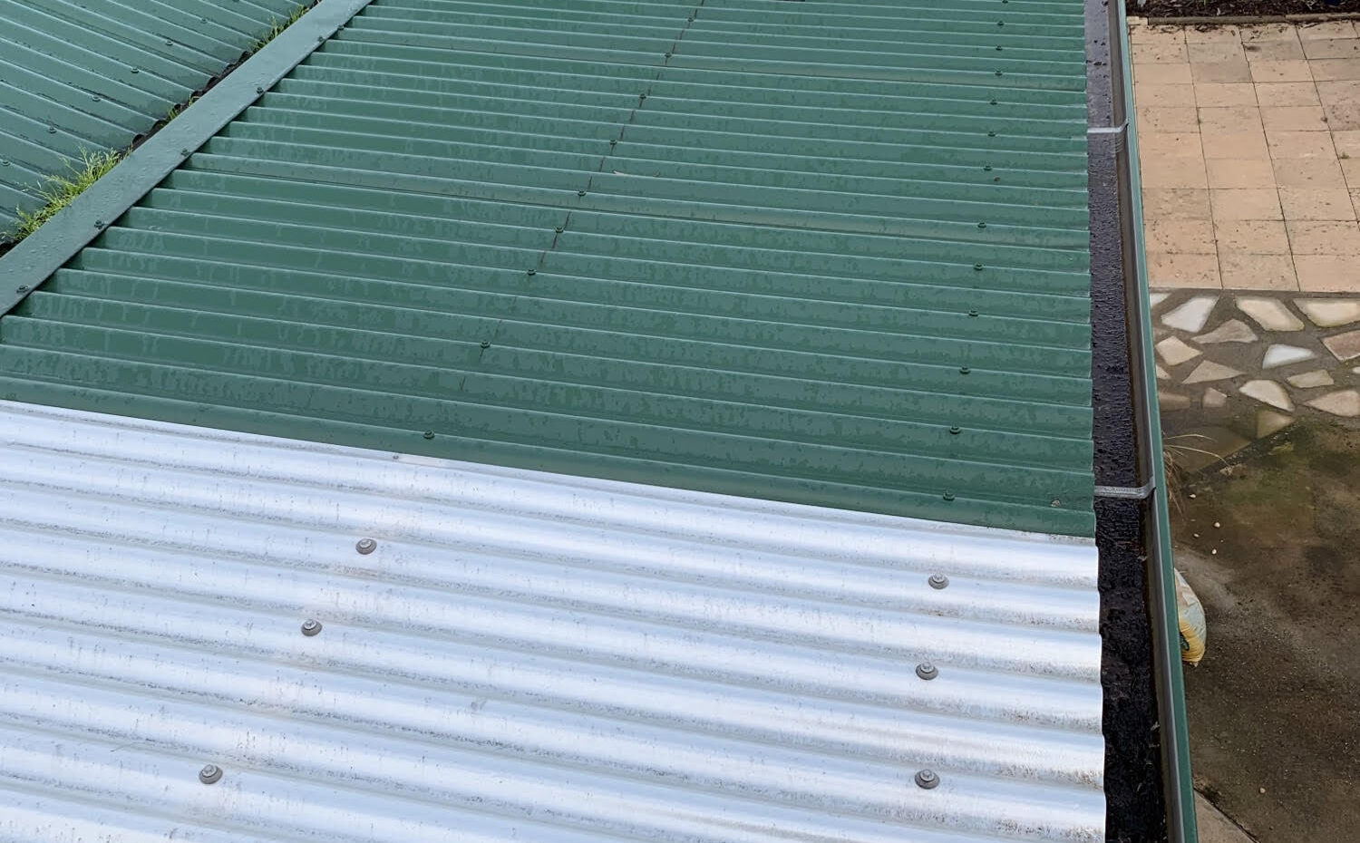 Photo of roof before green gutter guard installed