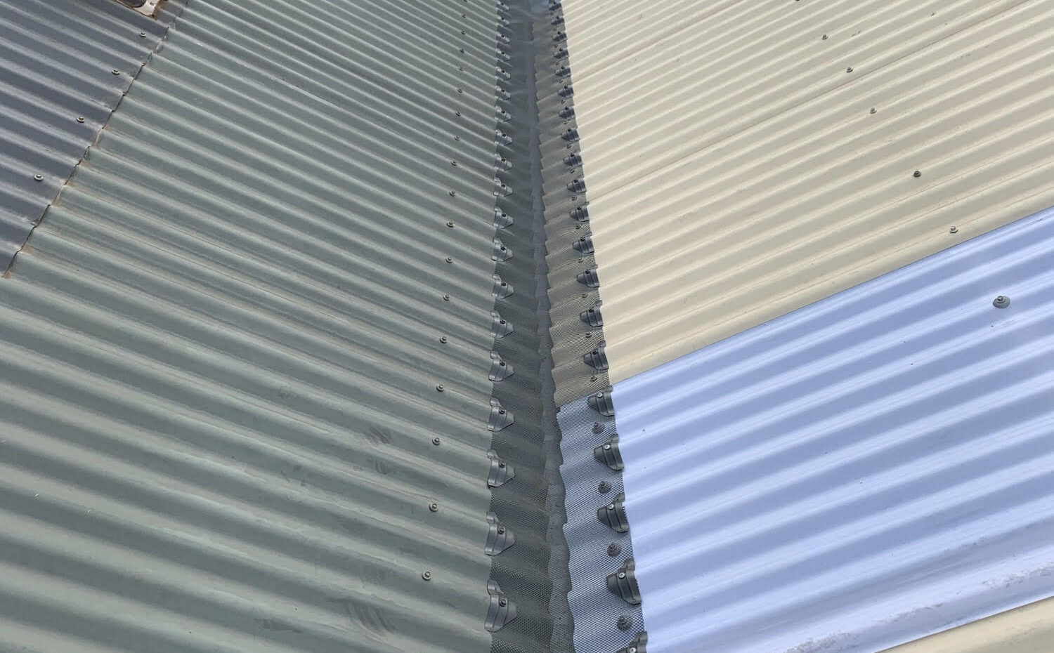 Photo of roof with grey gutter guard installed